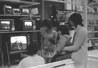 Shoppers watching the US Senate Watergate Hearings on televisions in a Sears department store in Los Angeles, California, 1973. The Regents of the University of California (CC BY 4.0).