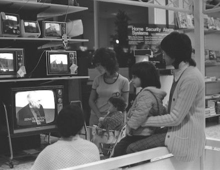 Shoppers watching the US Senate Watergate Hearings on televisions in a Sears department store in Los Angeles, California, 1973. The Regents of the University of California (CC BY 4.0).