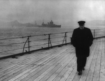 Prime Minister Winston Churchill walks the deck of HMS Prince of Wales during the Atlantic Conference, 1941. Library of Congress. Public Domain.